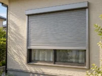 住宅の窓シャッター。上部ボックス、スラット、左右のガイドレールが見える、AIで作成したイメージ画像。
